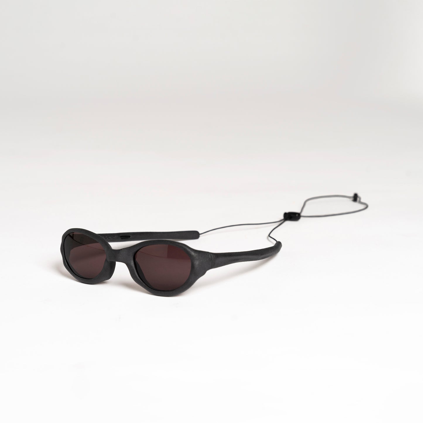 Wormholes Sunglasses – Vulcanic Black / Pyrope Red