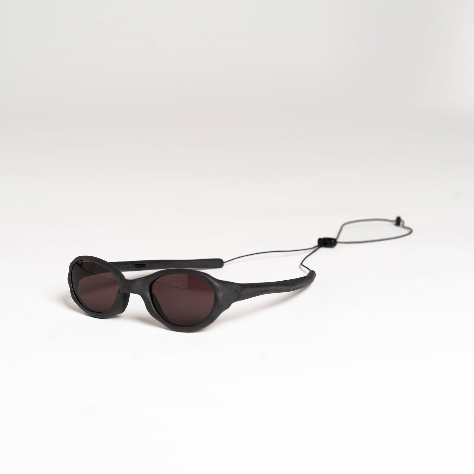 Wormholes Sunglasses – Vulcanic Black / Pyrope Red
